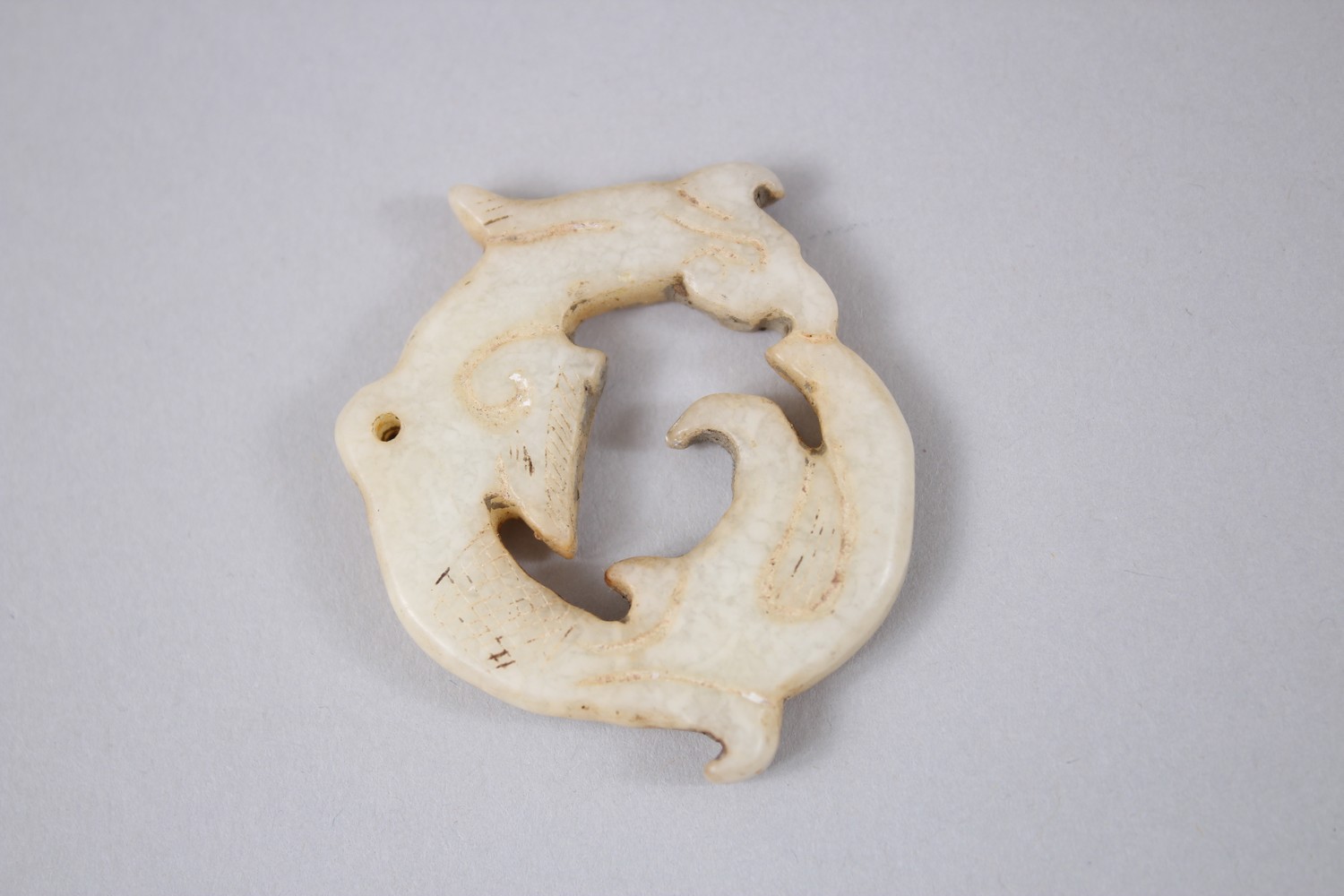 A 19TH / 20TH CENTURY CHINESE CARVED JADE PENDANT OF A DRAGON, 4.6cm diameter. - Image 2 of 2
