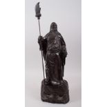 A GOOD 19TH / 20TH CENTURY CHINESE HARDWOOD HARVED FIGURE OF A BEARDED WARRIOR, stood on a tree
