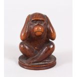 A GOOD JAPANESE LATE MEIJI PERIOD CARVED WOOD OKIMONO OF A MONKEY, with its hand over its ears, 4.
