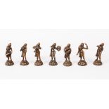 A MIXED LOT OF SEVEN 19TH / 20TH CENTURY INDIAN BRONZE MUSICIAN FIGURES, each holding a different