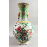 A GOOD 19TH CENTURY CHINESE FAMILLE ROSE BOTTLE VASE painted with birds, flowers and insects, with