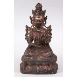 A GOOD EARLY CHINESE BRONZE BUDDHA / DEITY, in a seated position on a lotus base, holding a fruit or