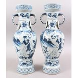 A GOOD PAIR OF CHINESE MING STYLE PORCELAIN TWIN HANDLE VASES, the body decorated to depict immortal