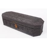 AN 18TH CENTURY CEYLONESE CARVED EBONY LIDDED BOX, the box carved with detailed all-over floral