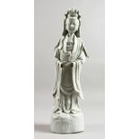 A 19TH CENTURY CHINESE BLANC-DE-CHINE FIGURE OF GUANYIN, 14ins high.