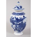 A GOOD CHINESE BLUE AND WHITE PORCELAIN TEA CADDY AND COVER, decorated with landscape scenes, 14cm