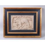 A CHINESE SANDSTONE RELIEF PANEL depicting a Buddhistic lion, framed. 20cms x 31cms.
