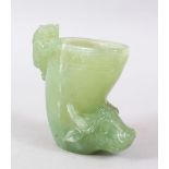 A GOOD CHINESE CARVED JADE / JADE LIKE LIBATION TYPE CUP, with a kylin and water buffalo, 10cm