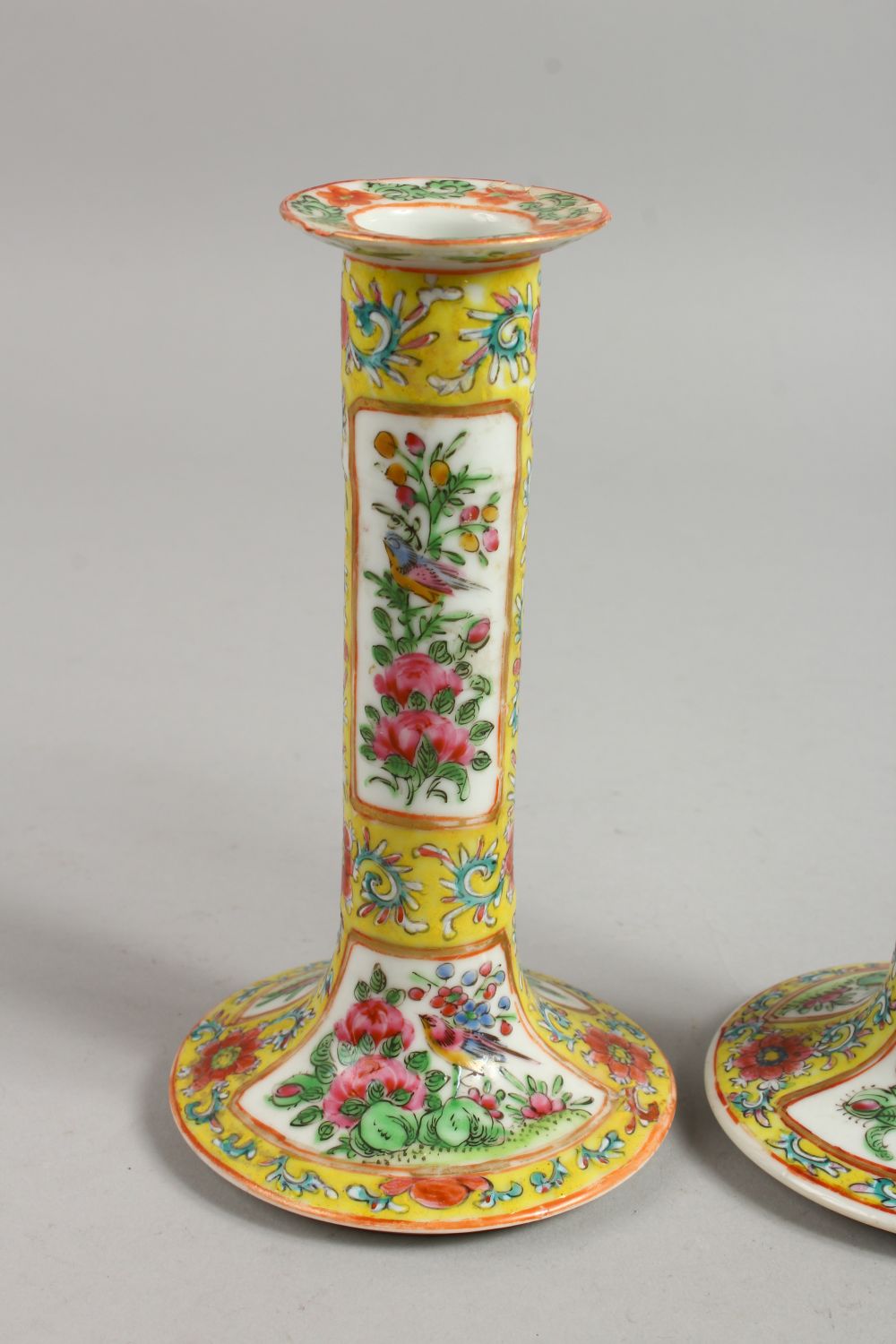 A GOOD PAIR OF CANTON FAMILLE JAUNE CANDLESTICKS with panels of flowers and birds. 7ins high. - Image 2 of 12