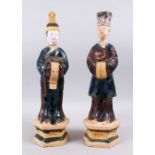 A PAIR OF CHINESE MING STYLE SANCAI POTTERY TOMB FIGURES, the figures stood on hexagonal form