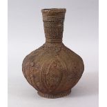 A SMALL 19TH / 20TH CENTURY PERSIAN BRONZE VASE, the body with carved decoration, 19cm high.