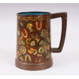 A 20TH CENTURY CHINESE CLOISONNE TANKARD / MUG, decorated with scenes of native flora, 13.3cm high x