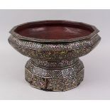 A LARGE 19TH CENTURY THAI MOTHER OF PEARL INLAID LACQUERED TWELVE-SIDED PEDESTAL BOWL, 36cm diameter