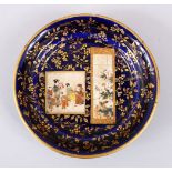 A GOOD JAPANESE MEIJI PERIOD SATSUMA DISH - BY KINKOZAN, gilded floral decoration upon a blue ground