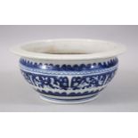 A 19TH CENTURY CHINESE BLUE & WHITE PORCELAIN JARDINIERE, decorated with formal scrolling foliage,