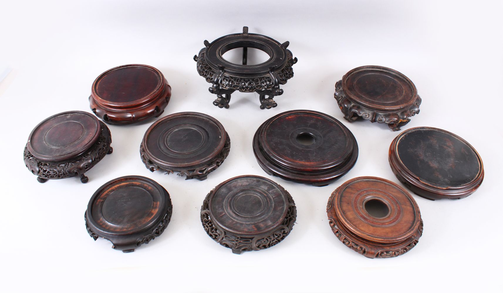 A MIXED LOT OF 10 19TH / 20TH CENTURY CHINESE CARVED AND PIERCED HARDWOOD STANDS, various styles,