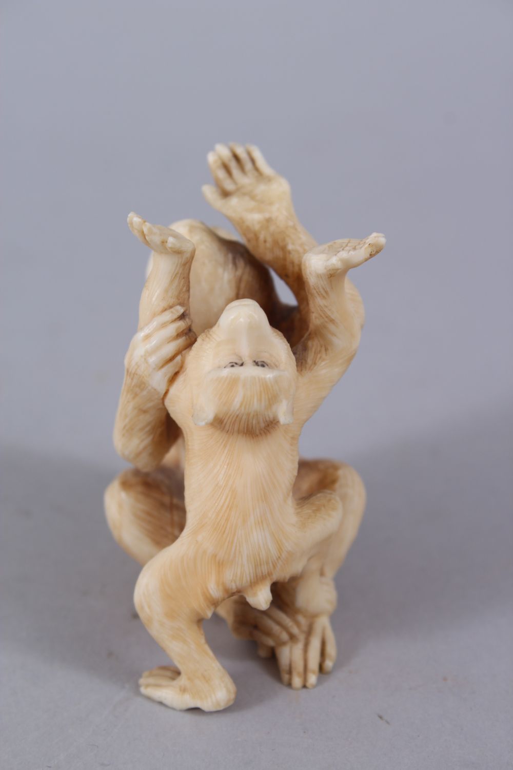 A JAPANESE MEIJI PERIOD CARVED OKIMONO GROUP OF MONKEYS, two seated monkeys play, 6.5cm high x 5cm - Image 4 of 5