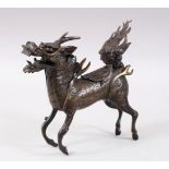 A GOOD CHINESE MING DYNASTY STYLE BRONZE QILIN INSENCE BURNER, stood in a striding pose with its