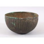 A GOOD EARLY PERSIAN SASSANIAN OR AKHAMINID BRONZE BOWL, C500 - 1000BC, the body ribbed, 15cm