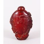 A GOOD QIANLONG CHINESE CARVED AMBER SNUFF BOTTLE, decorated with scenes of cranes amongst pine