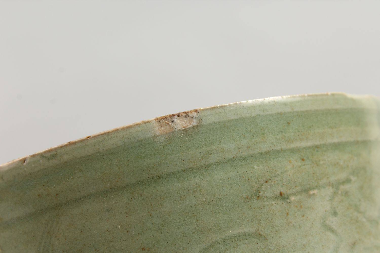 AN EARLY CHINESE LONGQUAN CELADON CIRCULAR CELADON CENSER on three legs. 5.5ins diameter. - Image 5 of 7