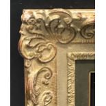 20th Century European School. A Gilt Composition Frame, with Swept Corners, with a Painted Slip,