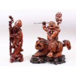 TWO GOOD 19TH / 20TH CENTURY CHINESE CARVED HARDWOOD FIGURES, one of an immortal upon the back of