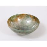 A GOOD CHINESE AGATE / JADE HARDSTONE TEA BOWL, 7.5cm diameter.