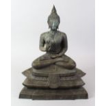 A LARGE 20TH CENTURY TIBETAN BRONZE FIGURE OF BUDDHA, seated upon lotus base in meditating position,