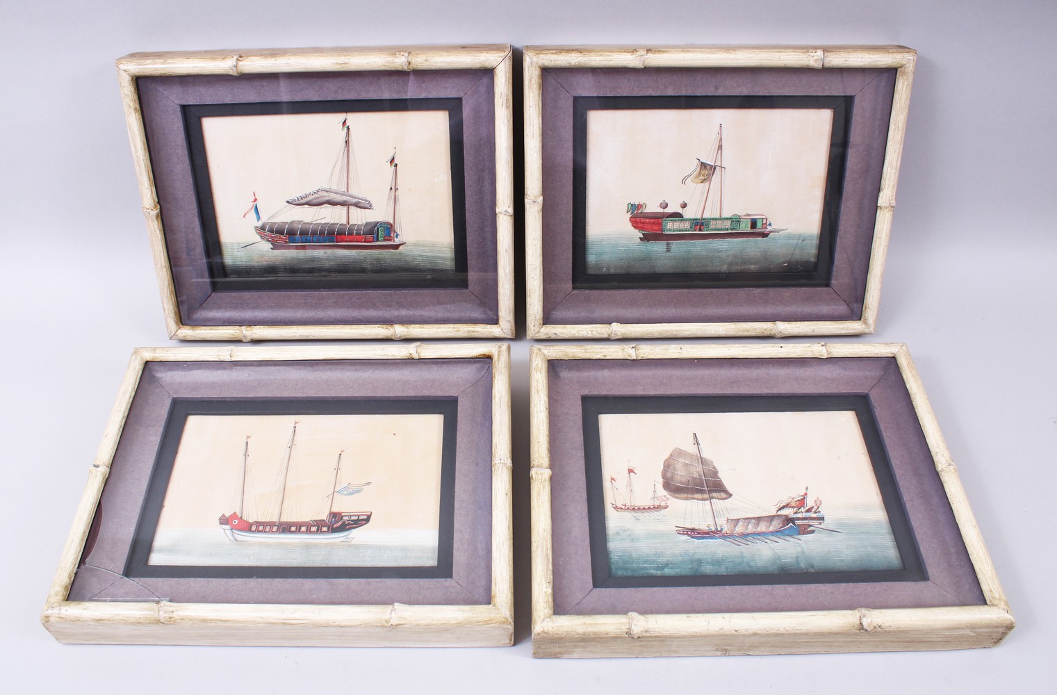 A SET OF FOUR CHINESE SCHOOL WATERCOLOURS, depicting ships sailing at sea, 16cm x 23cm.