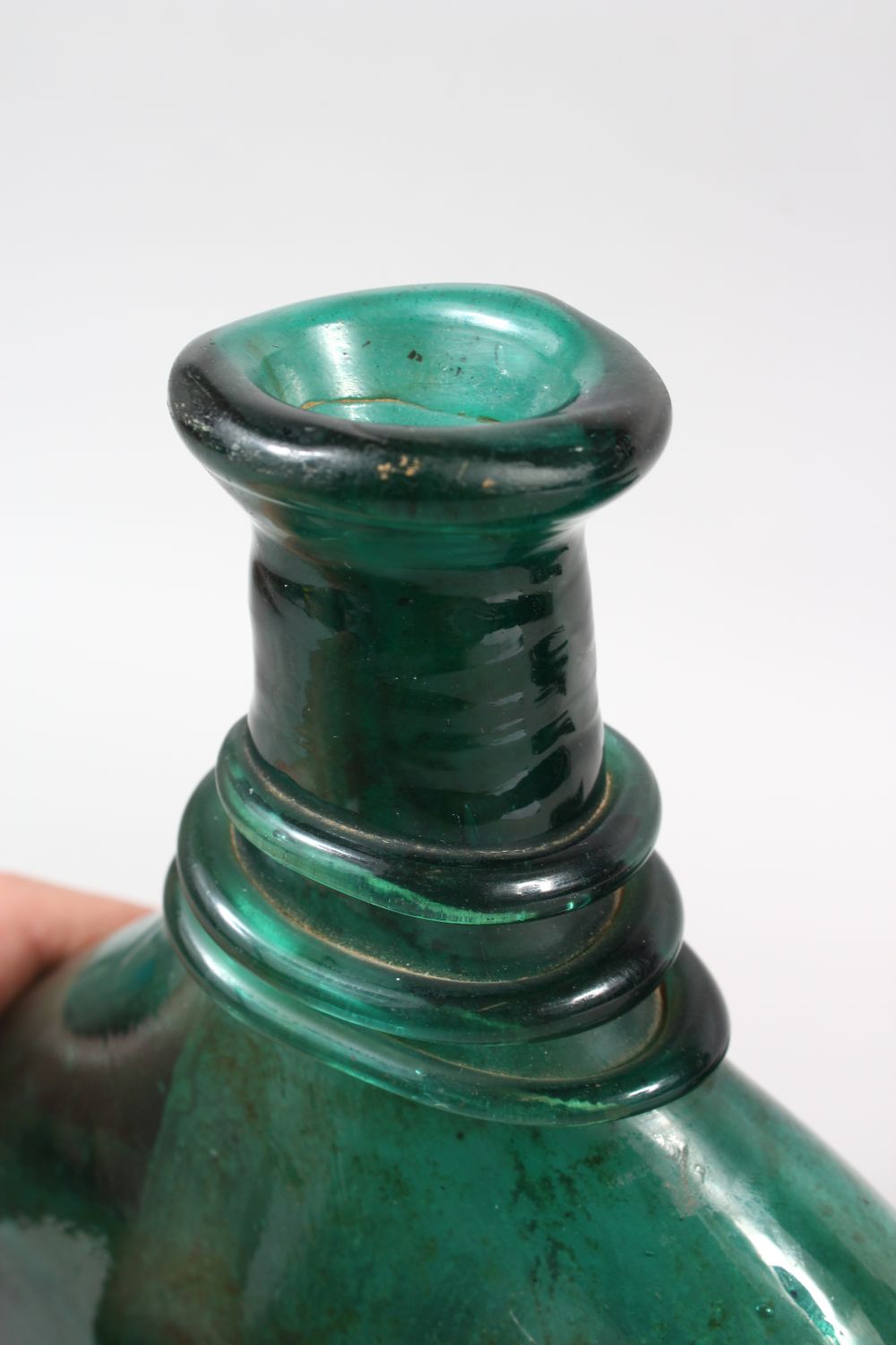 THREE EARLY QAJAR GLASS BOTTLES, 25cm high (3). - Image 3 of 5