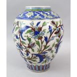 A GOOD QAJAR POTTERY VASE, decorated with flowers, 29cm high.