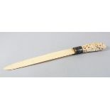A GOOD 19TH CENTURY BURMESE IVORY PAGE TURNER, with a well carved handle and Niello Silver collar,