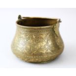 A VERY FINE 18TH/19TH CENTURY QAJAR HAND CHASED BRASS BOWL WITH SWING HANDLE, the body engraved with