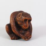 A GOOD JAPANESE MEIJI PERIOD CARVED WOODEN NETSUKE OF A MONKEY BY MASANAO, the monkey in a seated