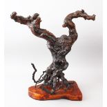 A GOOD CHINESE NATURALISTIC ROOTWOOD SCULPTURE, mounted on a hardwood base, 57cm high x 61cm wide.