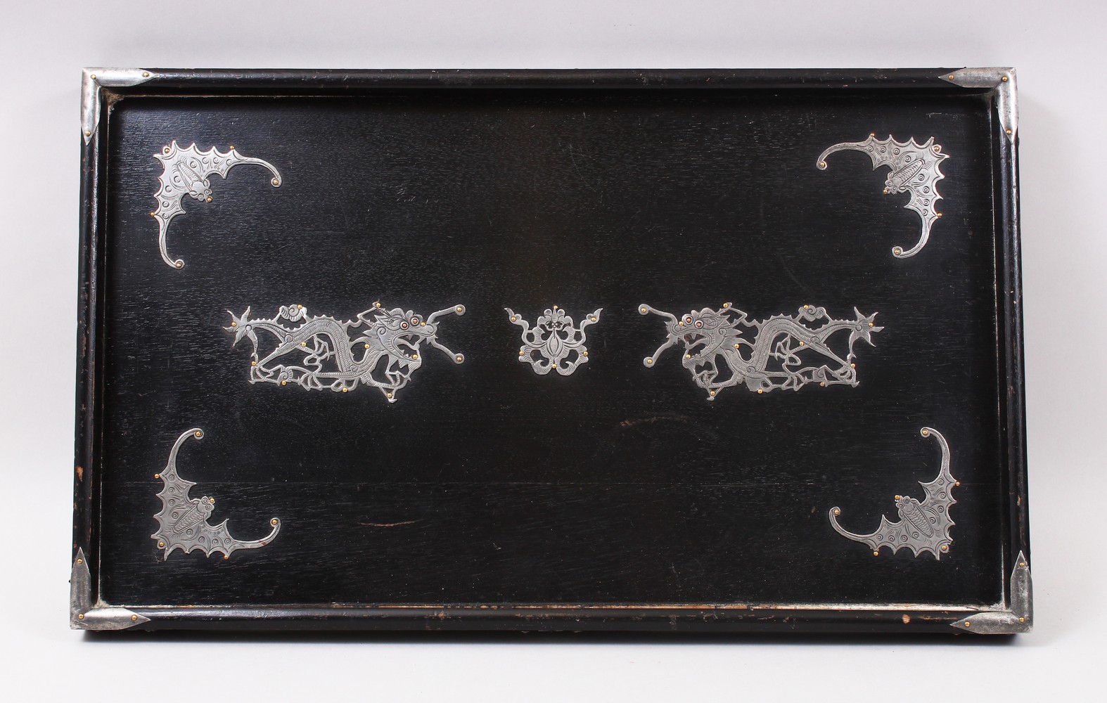 A GOOD CHINESE EARLY 20TH CENTURY PEWTER ONLAID WOODEN TRAY, the tray with pewter dragon and bat