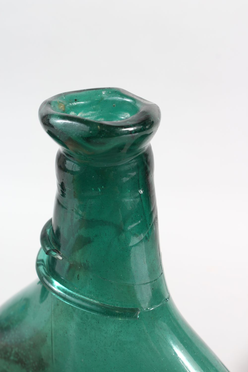 THREE EARLY QAJAR GLASS BOTTLES, 25cm high (3). - Image 4 of 5