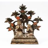 A FINE 18TH / 19TH CENTURY INDIAN OR NEPALESE BRONZE OIL LAMP, of a seated couple with five oil