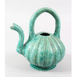 A RARE 18TH/19TH MAGHUL INDIAN GLAZED TURQUOISE POTTERY EWER, 20cm high x 18.5cm wide.