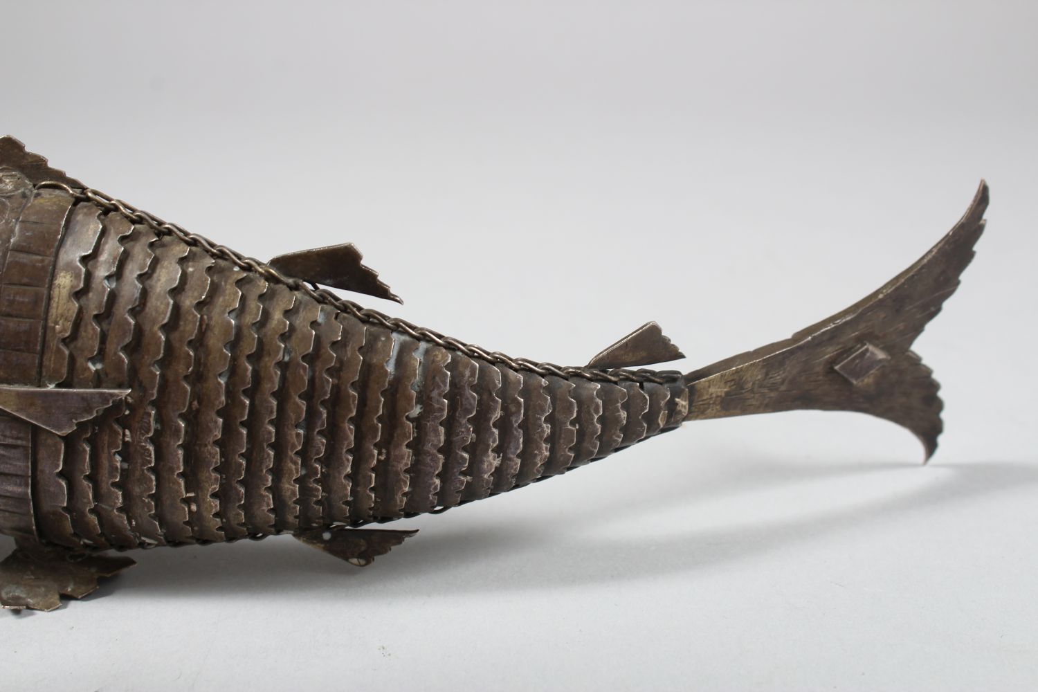 A 19TH CENTURY INDIAN SILVER RETICULATED FISH SHAPED SPICE BOX, the head opening, 25cm long - Image 5 of 6
