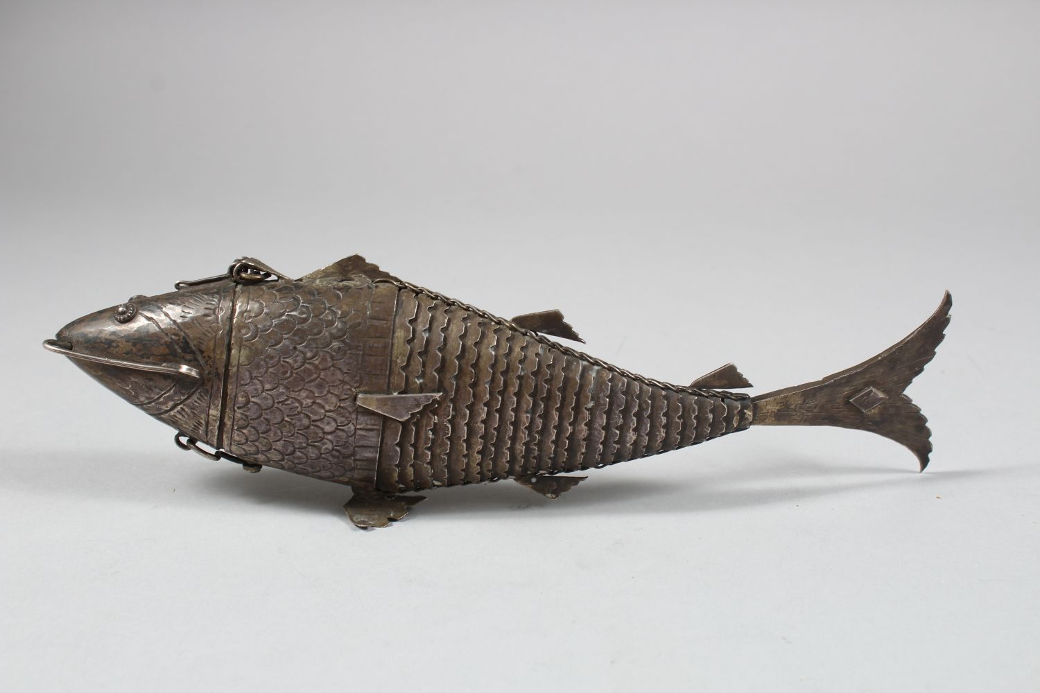 A 19TH CENTURY INDIAN SILVER RETICULATED FISH SHAPED SPICE BOX, the head opening, 25cm long - Image 2 of 6