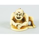 A JAPANESE MEIJI PERIOD CARVED IVORY NETUSKE OF A MIRROR POLISHER BY MASAYUKI, the worker over a