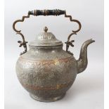 A VERY LARGE ISFAHAN BRONZE KETTLE, with engraved decoration, and turned wood handle, 37cm high.