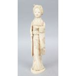 A JAPANESE MEIJI PERIOD CARVED IVORY OKIMONO OF A GEISHA GIRL, the lady stood holding some