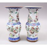 A PAIR OF 19TH / 20TH CENTURY CHINESE DOUCAI PORCELAIN VASES, the body of the yen yen vases