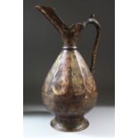 A KHORASAN STYLE BRONZE BULBOUS JUG, with engraved panels, 34cm high.