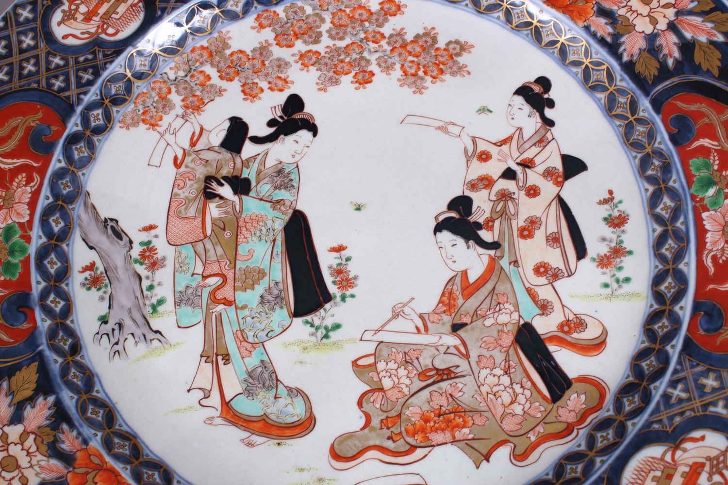A GOOD PAIR OF JAPANESE MEIJI PERIOD IMARI PORCELAIN CHARGERS, decorated with scenes of girls in - Image 3 of 7