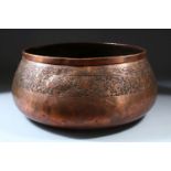 A LARGE ISLAMIC MAMLUK CIRCULAR COPPER BOWL, engraved with a band of animals and flowers, 33cm