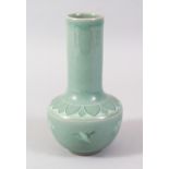 A KOREAN CELADON GLAZED SMALL PORCELAIN VASE, painted with cranes in flight, signed, 17cm high.